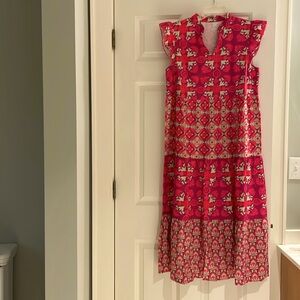 Gorgeous airy tiered dress with ruffled sleeves. Never worn